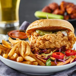 fried chicken sandwich with coleslaw and french fries